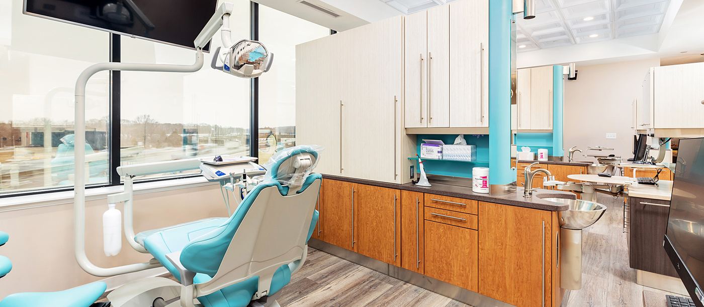 Treatment room with natural light and ceiling screen at Aesthetic Smile Reconstruction, Waltham MA